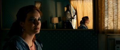 Still from Drive (2011) that has been tagged with: night & interior & over-the-shoulder & medium wide & medium close-up