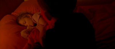 Still from Enter The Void (2009) that has been tagged with: over-the-shoulder & interior & night & bedroom