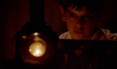 Still from Fanny and Alexander (1982) that has been tagged with: 6e1c1c & interior & medium close-up & night