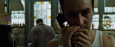 Still from Fight Club (1999) that has been tagged with: medium close-up & day & interior & phone