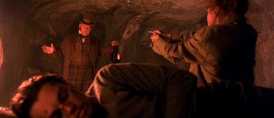 Still from Gangs of New York (2002) that has been tagged with: over-the-shoulder & catacombs