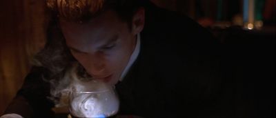 Still from Gattaca (1997) that has been tagged with: interior & clean single & smoke & medium close-up