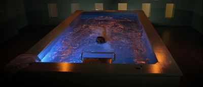 Still from Gattaca (1997) that has been tagged with: wide shot & swimming pool & interior