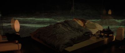 Still from Gattaca (1997) that has been tagged with: 714f38 & wide shot & bedroom & two-shot