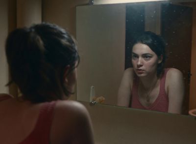Still from Happening (2021) that has been tagged with: reflection & night & mirror