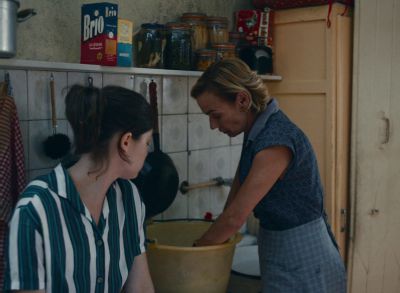 Still from Happening (2021) that has been tagged with: kitchen & working & laundry