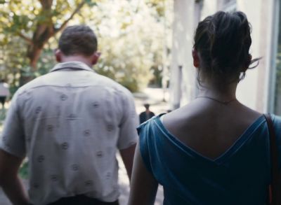 Still from Happening (2021) that has been tagged with: exterior & day & two-shot & medium shot