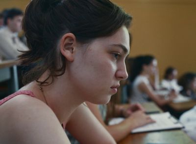 Still from Happening (2021) that has been tagged with: classroom & profile shot