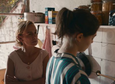 Still from Happening (2021) that has been tagged with: kitchen & interior & two-shot & day & medium shot