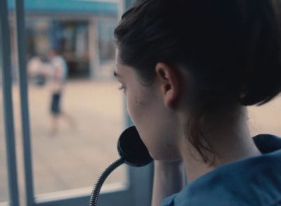 Still from Happening (2021) that has been tagged with: pay phone