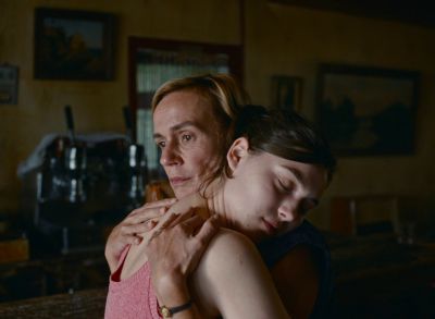 Still from Happening (2021) that has been tagged with: kitchen & hug