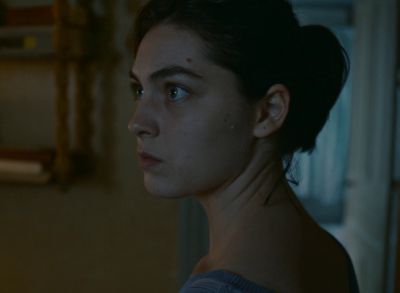 Still from Happening (2021) that has been tagged with: profile shot & interior & night