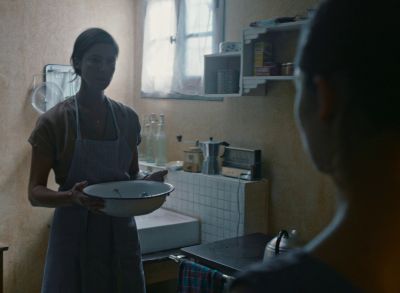 Still from Happening (2021) that has been tagged with: kitchen & two-shot & medium wide & interior