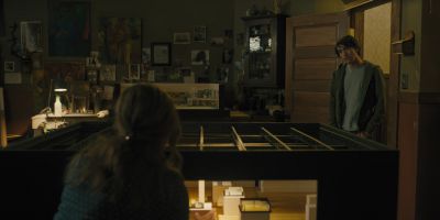 Still from Hereditary (2018) that has been tagged with: wide shot & night & over-the-shoulder
