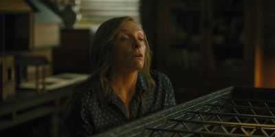 Still from Hereditary (2018) that has been tagged with: 836a54 & medium close-up & interior