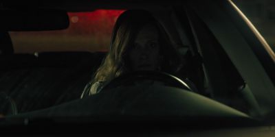 Still from Hereditary (2018) that has been tagged with: clean single & car & night & medium close-up