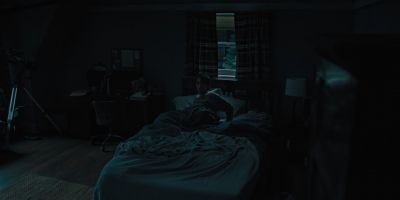 Still from Hereditary (2018) that has been tagged with: bed & night & bedroom & interior