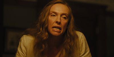 Still from Hereditary (2018) that has been tagged with: da8a67 & interior & medium close-up & clean single