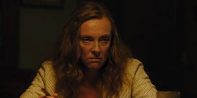 Still from Hereditary (2018) that has been tagged with: b4a541 & medium shot & night & interior