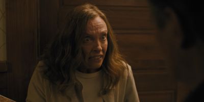 Still from Hereditary (2018) that has been tagged with: a67a59 & interior & establishing shot & medium close-up
