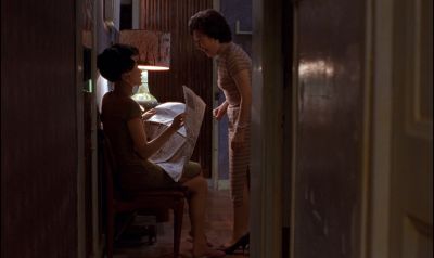 Still from In the Mood For Love (2000) that has been tagged with: newspaper