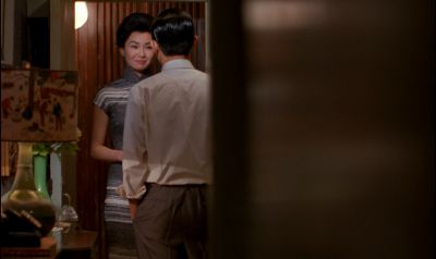 Still from In the Mood For Love (2000) that has been tagged with: doorway & interior & over-the-shoulder & medium wide