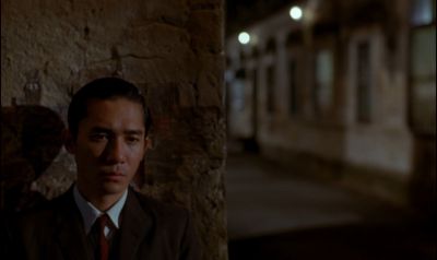 Still from In the Mood For Love (2000) that has been tagged with: 1a2321 & medium close-up & exterior & clean single