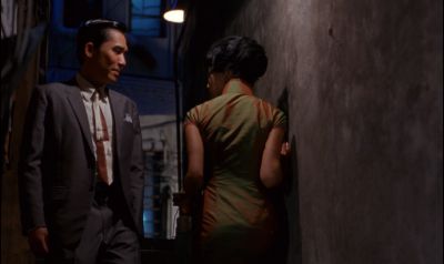 Still from In the Mood For Love (2000) that has been tagged with: two-shot & medium wide