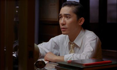 Still from In the Mood For Love (2000) that has been tagged with: interior & clean single & day & medium shot