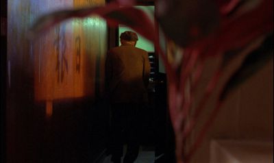 Still from In the Mood For Love (2000) that has been tagged with: 714f38 & plant & over-the-shoulder & hallway