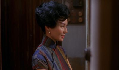 Still from In the Mood For Love (2000) that has been tagged with: 933e42 & night & medium shot & clean single