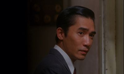 Still from In the Mood For Love (2000) that has been tagged with: doorway & medium close-up