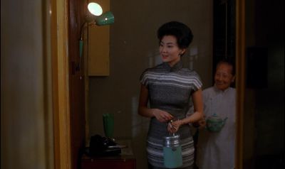 Still from In the Mood For Love (2000) that has been tagged with: interior & night & two-shot & medium wide