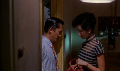 Still from In the Mood For Love (2000) that has been tagged with: 714f38 & interior & doorway & two-shot