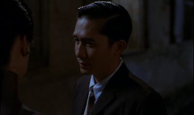 Still from In the Mood For Love (2000) that has been tagged with: 536793 & night & exterior & over-the-shoulder