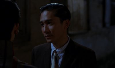 Still from In the Mood For Love (2000) that has been tagged with: night & medium shot & over-the-shoulder