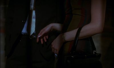 Still from In the Mood For Love (2000) that has been tagged with: 000000 & hands & night & purse