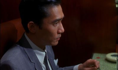 Still from In the Mood For Love (2000) that has been tagged with: night & interior & clean single & profile shot