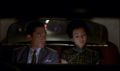 Still from In the Mood For Love (2000) that has been tagged with: interior & car & backseat & medium shot & car interior