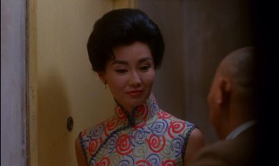 Still from In the Mood For Love (2000) that has been tagged with: 714f38 & interior & medium close-up & over-the-shoulder