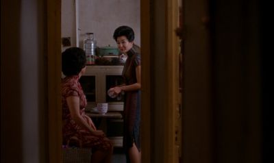 Still from In the Mood For Love (2000) that has been tagged with: wide shot & hallway & interior