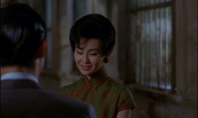 Still from In the Mood For Love (2000) that has been tagged with: interior & night & medium shot & over-the-shoulder