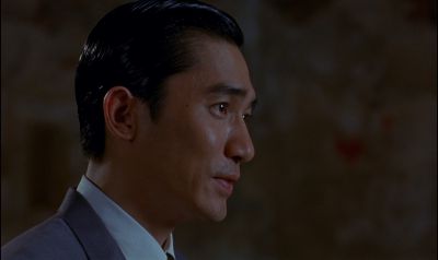 Still from In the Mood For Love (2000) that has been tagged with: night & profile shot & medium close-up