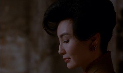 Still from In the Mood For Love (2000) that has been tagged with: night & exterior & clean single & profile shot & close-up
