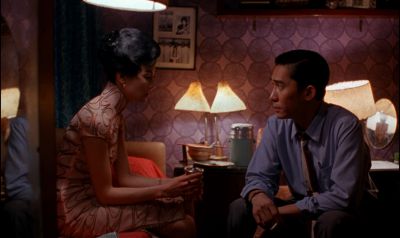 Still from In the Mood For Love (2000) that has been tagged with: interior & night & two-shot & medium wide