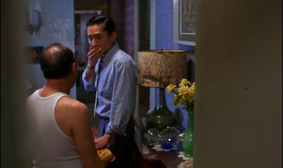 Still from In the Mood For Love (2000) that has been tagged with: 473d8a & night & medium wide & interior