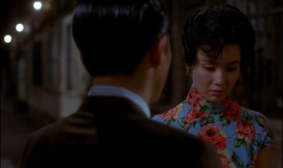 Still from In the Mood For Love (2000) that has been tagged with: night & medium shot & over-the-shoulder & exterior