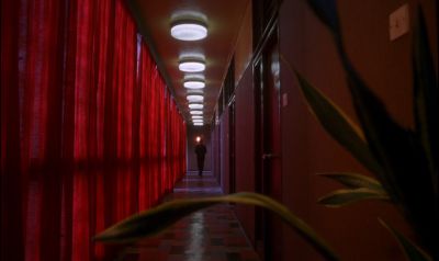 Still from In the Mood For Love (2000) that has been tagged with: hallway & wide shot & clean single