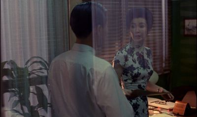 Still from In the Mood For Love (2000) that has been tagged with: d99059 & over-the-shoulder & medium wide & interior