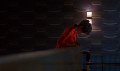 Still from In the Mood For Love (2000) that has been tagged with: clean single & profile shot & medium wide